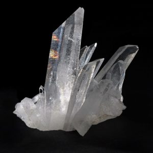 Quartz crystal is a solid that contains many vibrating atoms